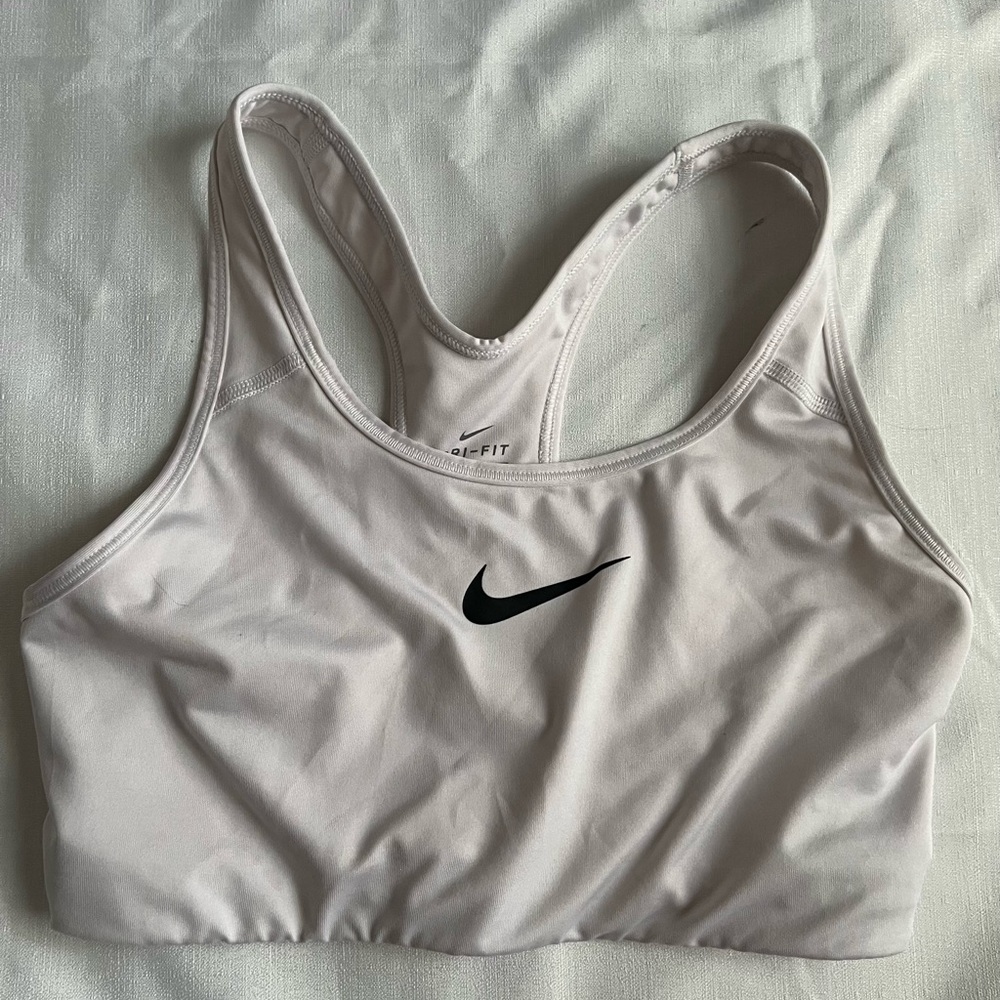 White Nike sports bra with paw print